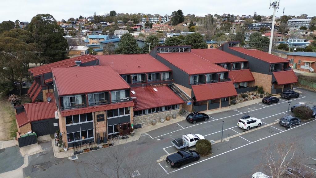 an aerial view of a building with red roofs at Alpine Gables in Jindabyne