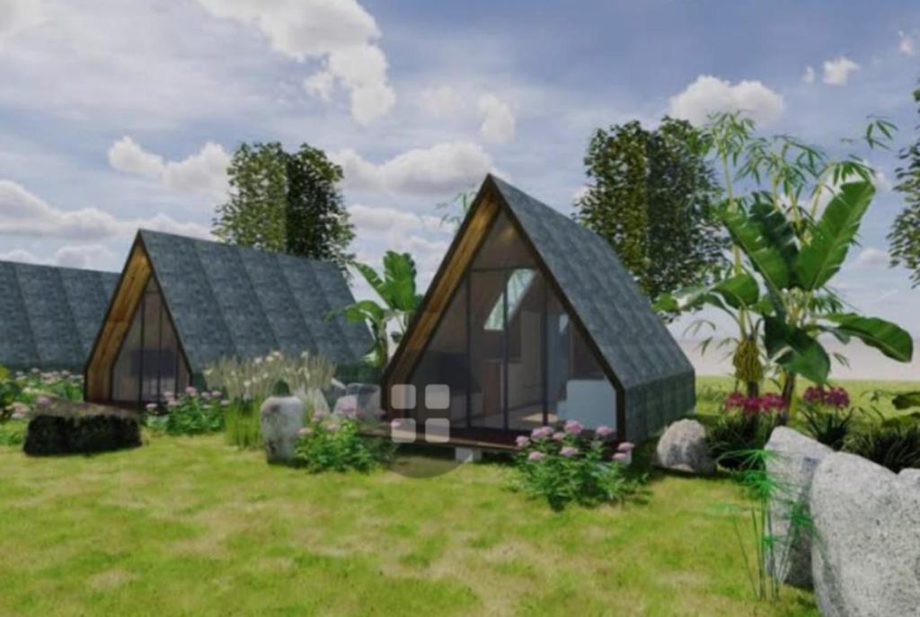 a rendering of a tiny house in a field at Vang Vieng KT Resort in Vang Vieng