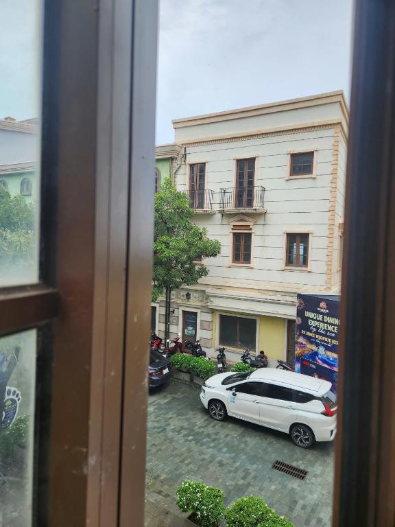 a view of a car parked in front of a building at Sunset Bridge Hotel Phu Quoc in Phú Quốc