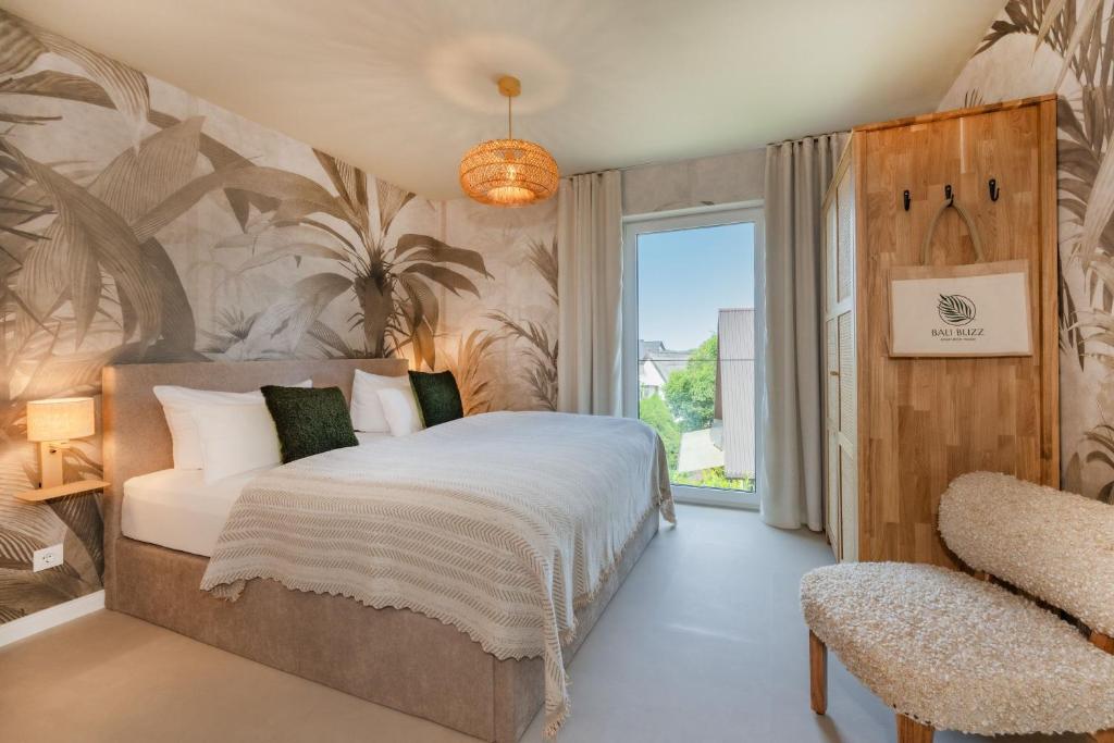 a bedroom with a bed and a large window at BALI BLIZZ - App 14 in Benz