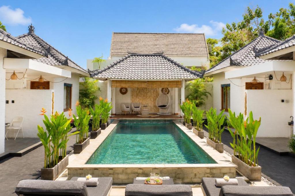 an image of a swimming pool in a villa at Empat Bintang Villas in Uluwatu