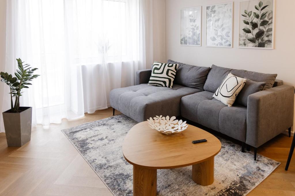 a living room with a couch and a coffee table at AN apartment 5 in Rēzekne