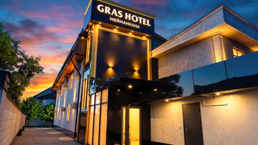 a building with a sign that reads grass hotel at Gras Business Hotel in Bishkek