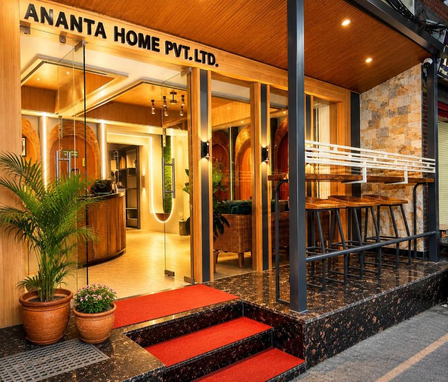 a store with a red rug in front of a building at Ananta Home in Kathmandu
