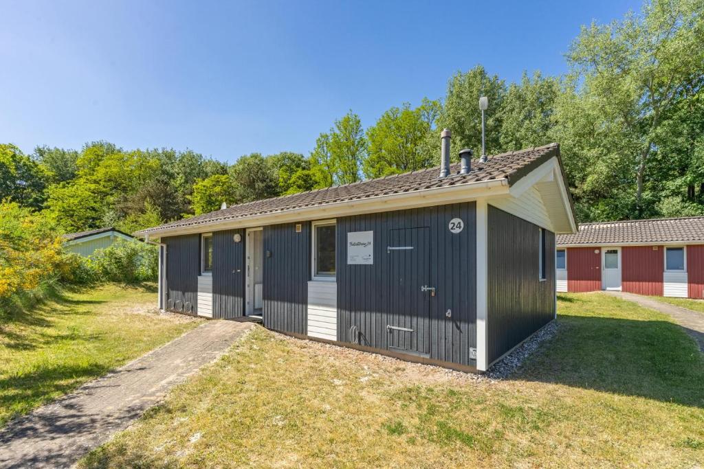 a large building with a garage at Strandhaus Freibeuterweg 24 in Priwall