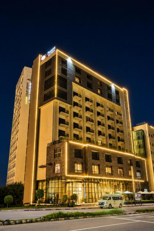 a hotel building with lights on top of it at Best Western Premier Dynasty in Addis Ababa