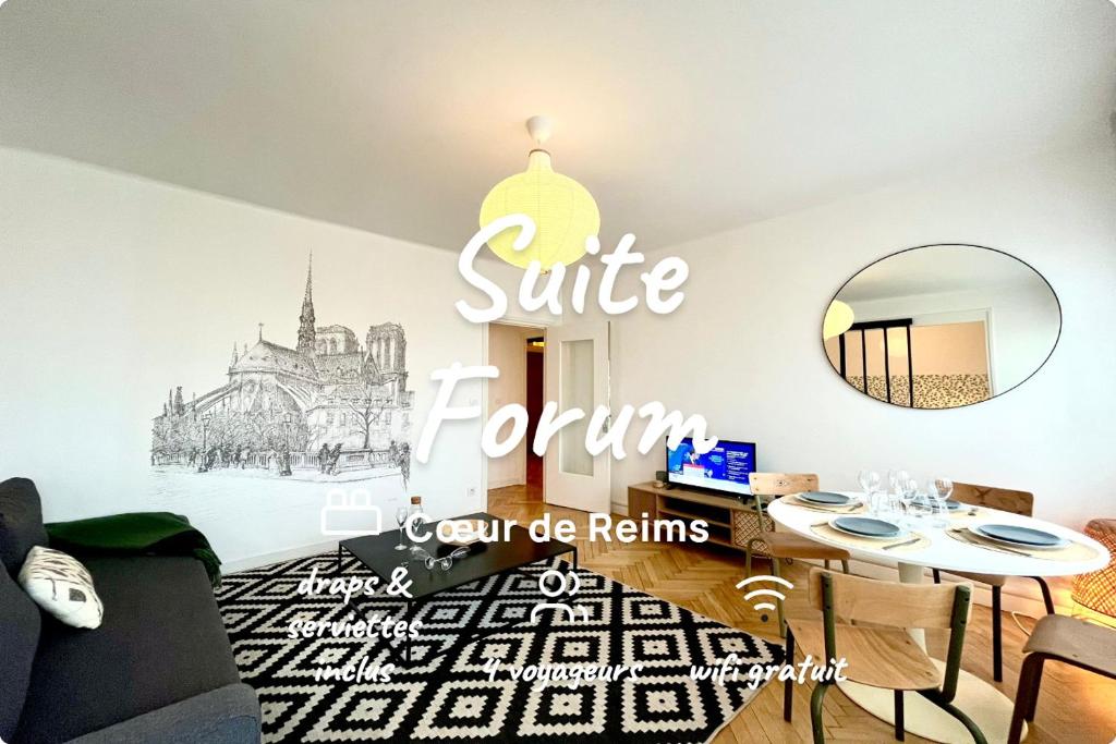 a living room with a table and a mirror at Suite Forum Vue Imprenable in Reims