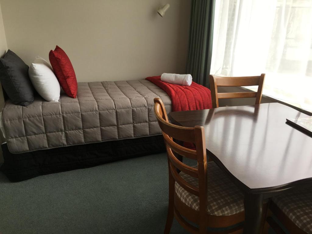 Postel nebo postele na pokoji v ubytování Ascot Oamaru Motel