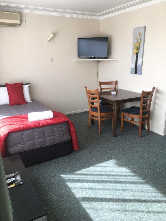 Postel nebo postele na pokoji v ubytování Ascot Oamaru Motel
