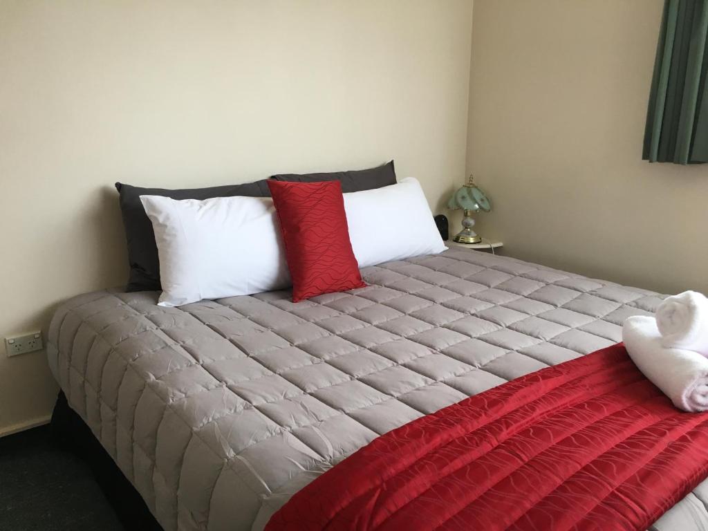 Postel nebo postele na pokoji v ubytování Ascot Oamaru Motel