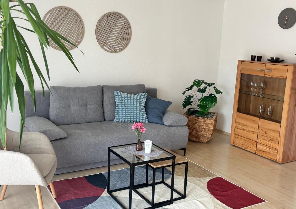 a living room with a couch and a table at Ferienwohnung Hofstatt im Grünen in Dürbheim