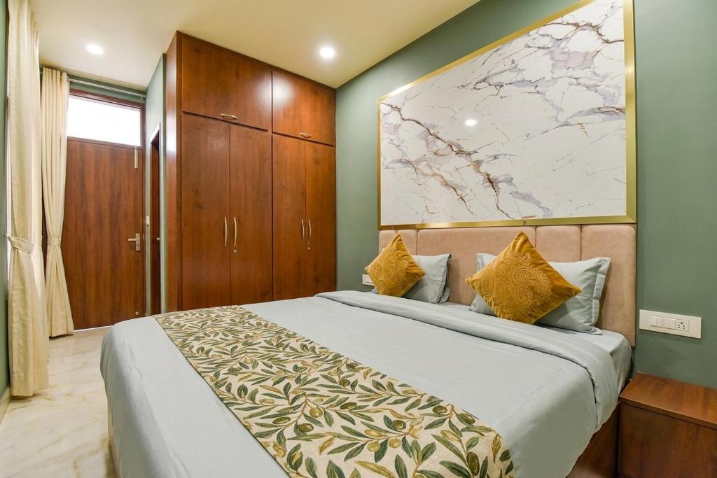 a bedroom with a large bed with a map on the wall at fabhotel nirmal in Lucknow
