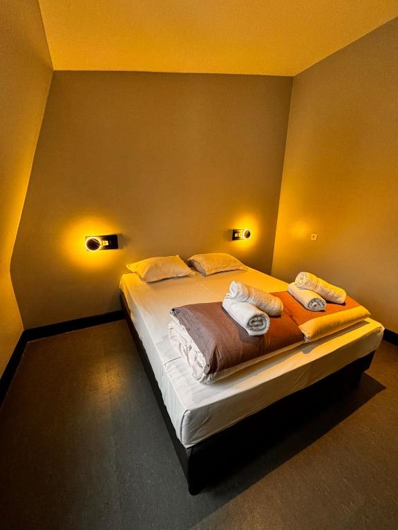 a bedroom with a large bed in a room at Brxxl 5 City Centre Hostel in Brussels