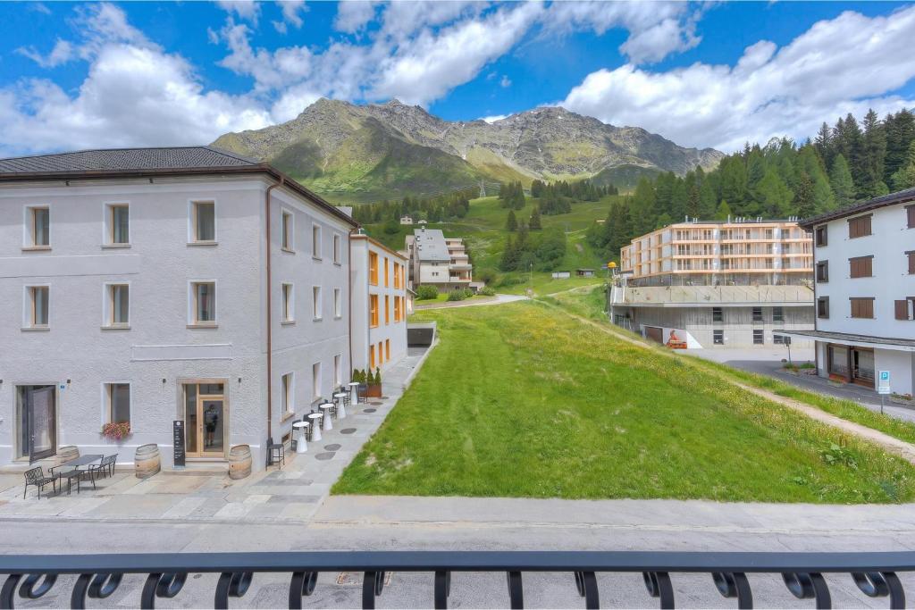 a view of a city with mountains in the background at Residenza Tilia in San Bernardino