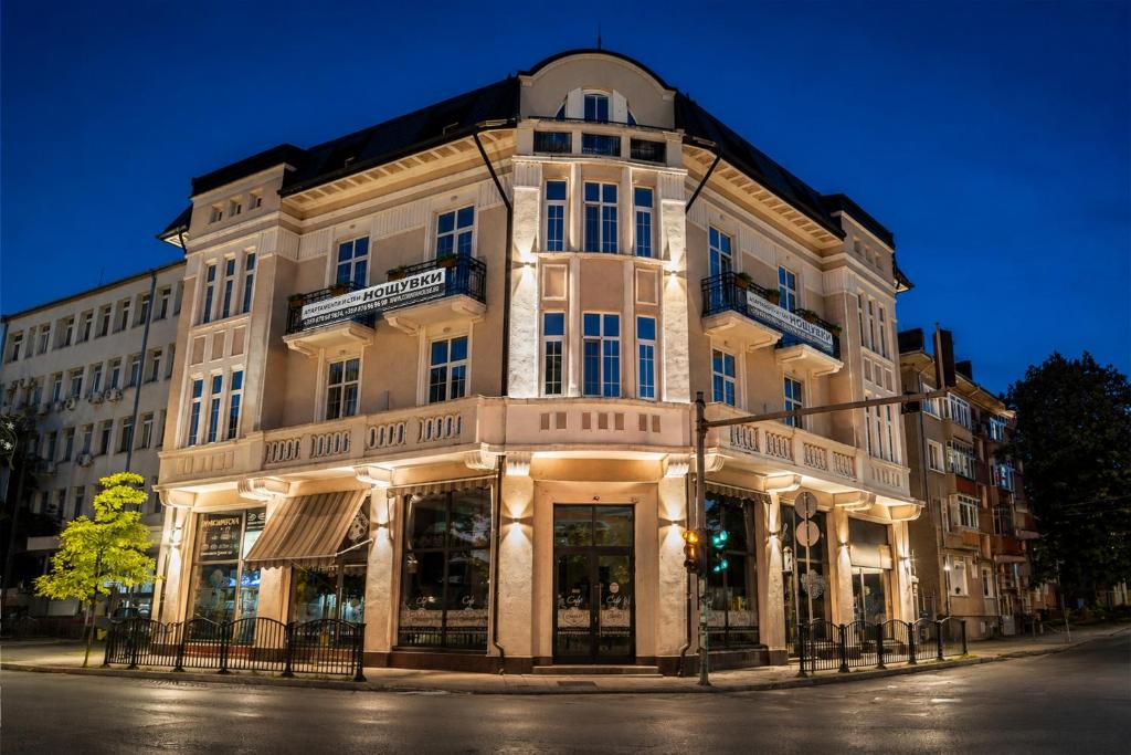 a large building on the corner of a street at Corner House in Lovech