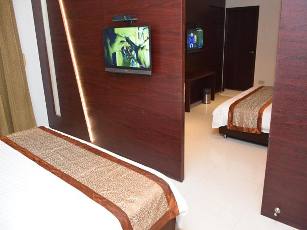 Postel nebo postele na pokoji v ubytování Hotel Sai Jashan Shirdi - Where blessings & comfort meet