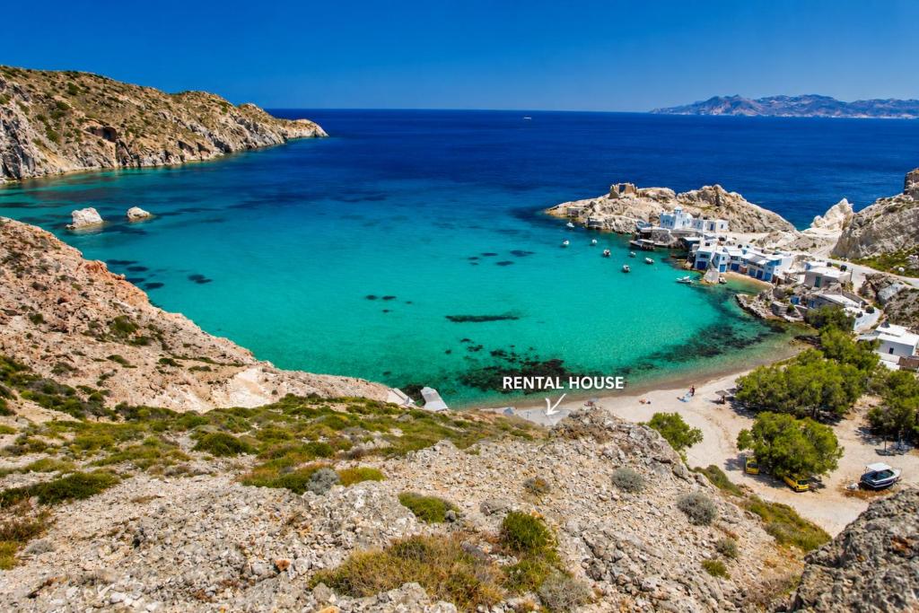 an aerial view of a beach with blue water at Paradiso in Firopótamos
