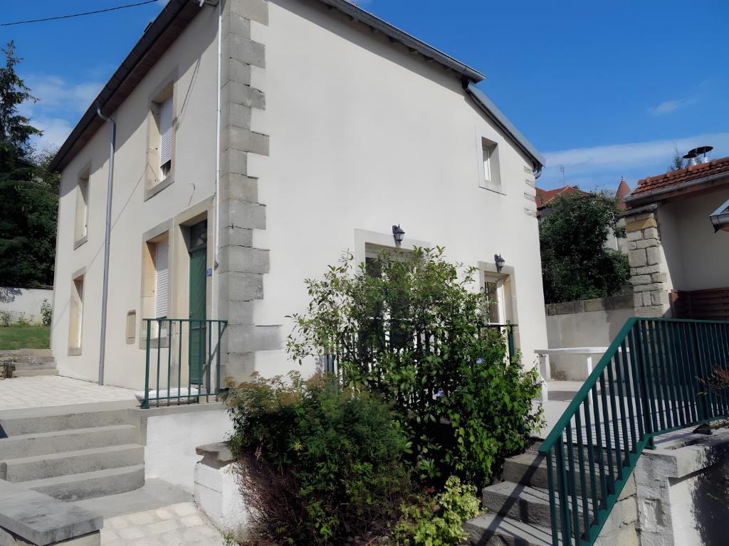 a white house with stairs and a green gate at Gîte Bourgeois in Isches