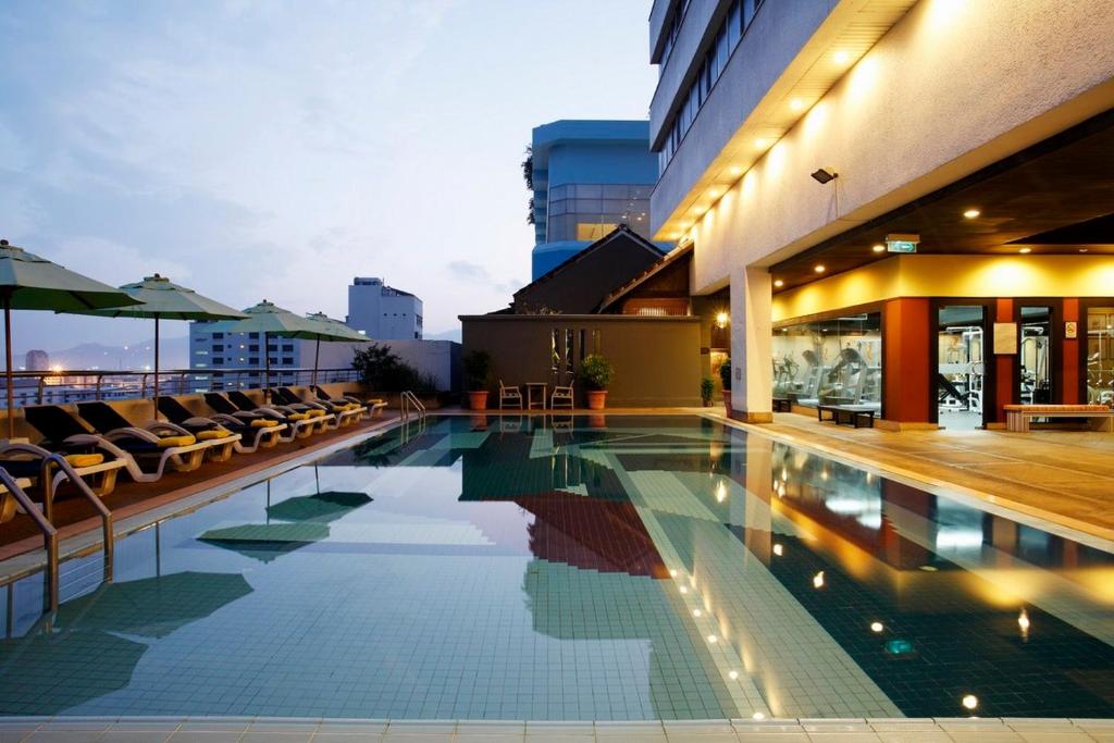 a swimming pool on the roof of a building at Centara Hotel Hat Yai in Hat Yai