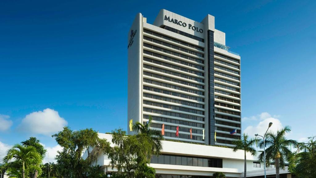 a large building with a sign on top of it at Marco Polo Plaza Cebu in Cebu City