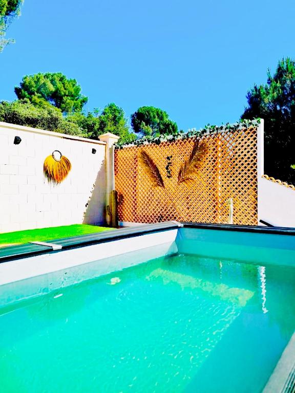 a swimming pool with a fence and some water at Mirador del Lago in Córdoba