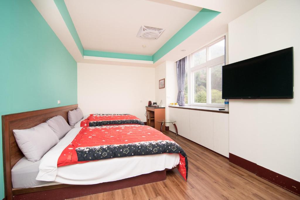 Postel nebo postele na pokoji v ubytování Nantou Xitou Riverside Homestay B&B