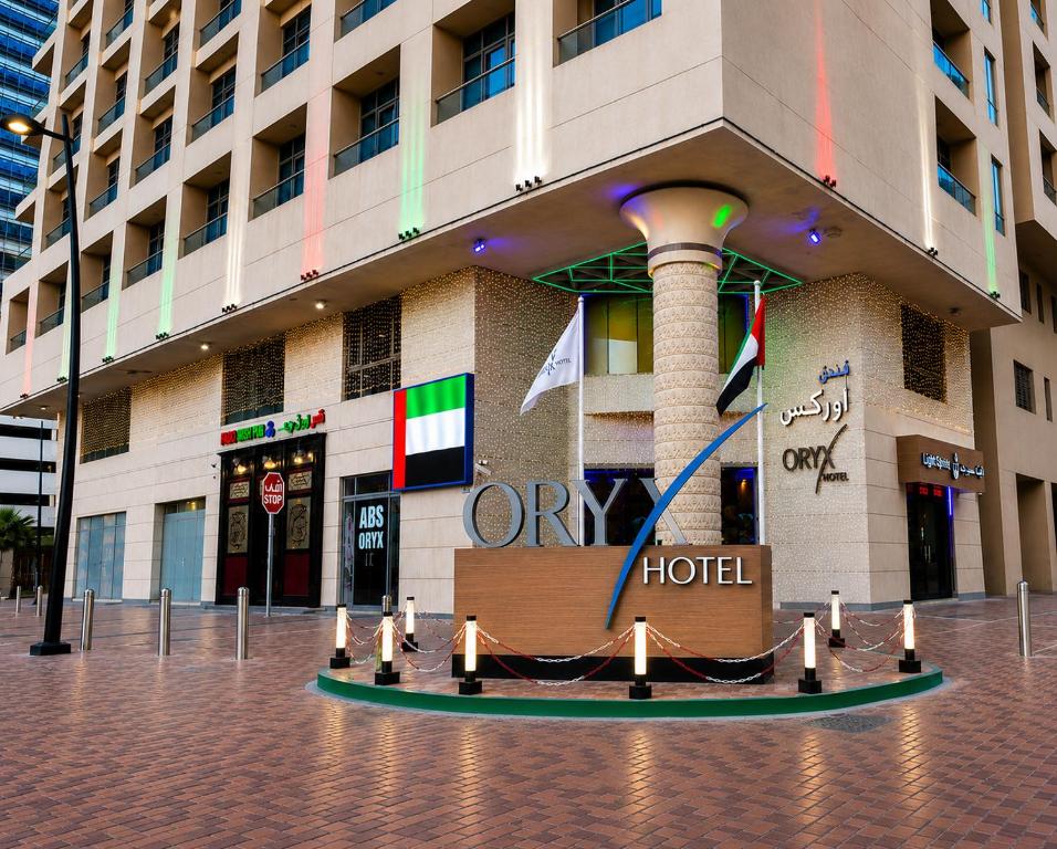 a hotel building with a display in front of it at Oryx Hotel in Abu Dhabi