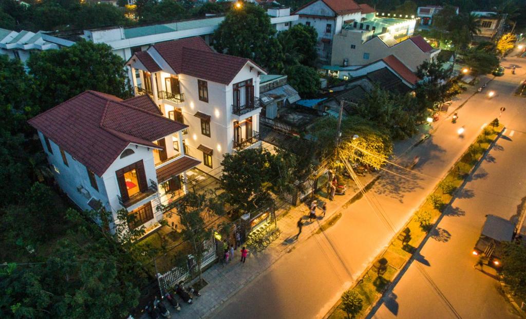 an overhead view of a street in a city at night at RedRose Villa in Hoi An