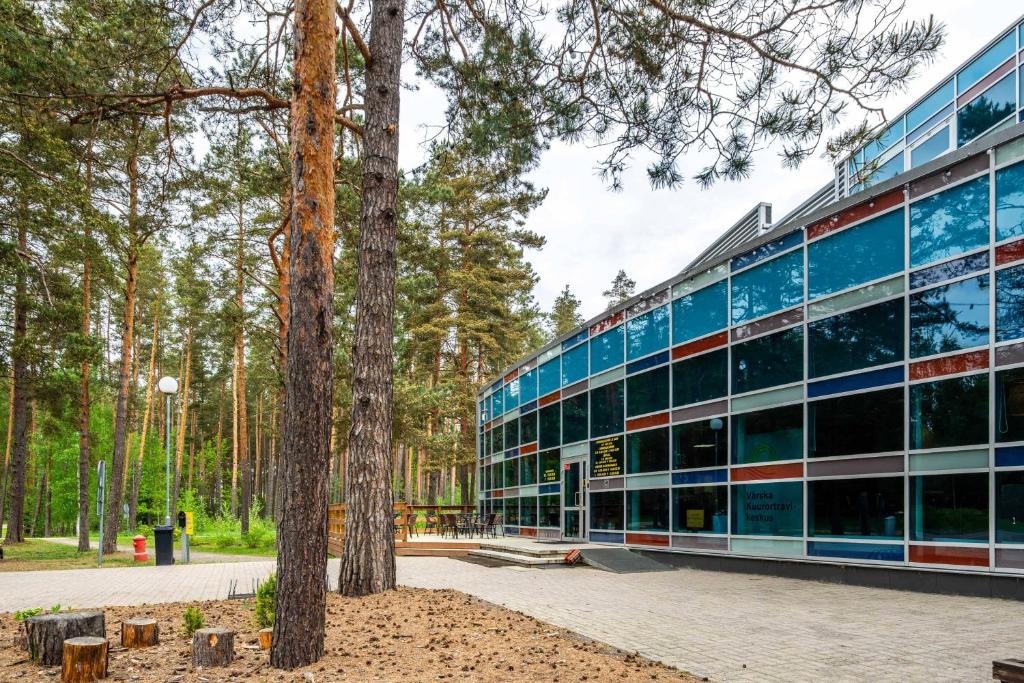 an office building with trees in front of it at Värska Veekeskuse hotell in Väike-Rõsna