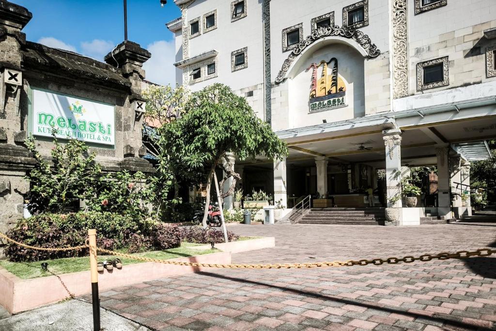 a building with a chain in front of it at Melasti Kuta Beach Hotel & Spa in Kuta