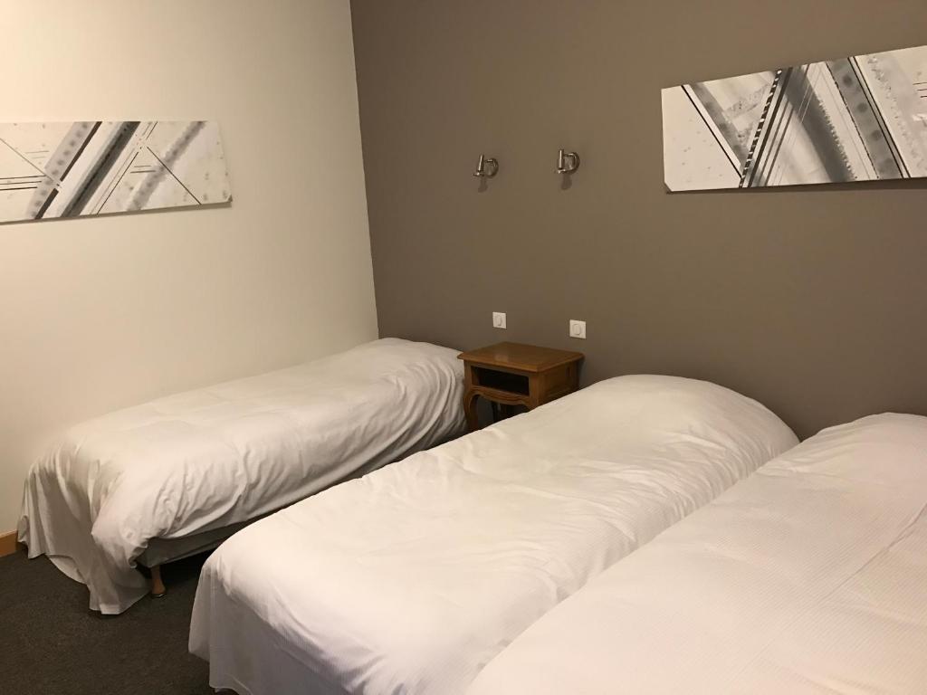Postel nebo postele na pokoji v ubytování Hôtel du Rangen