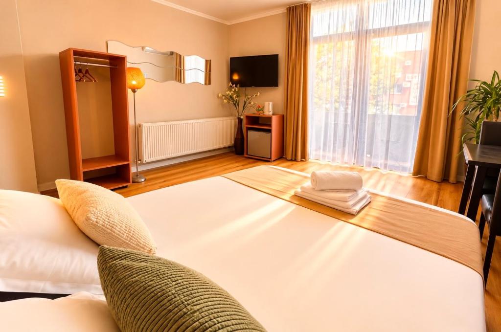 Llit o llits en una habitació de Hotel EOS