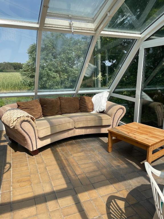 a living room with a couch and a coffee table at To Huus bei Hanne 
