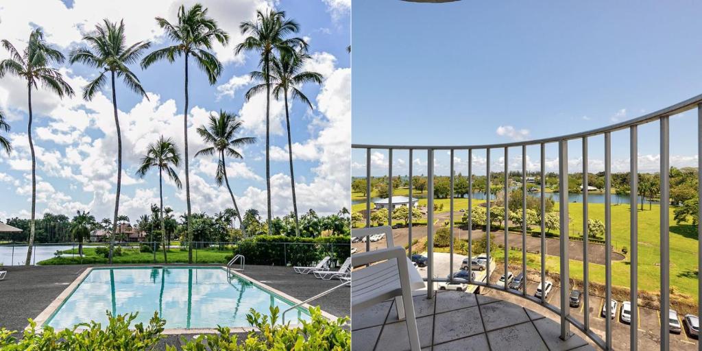 a view of the pool and palm trees from the balcony of a resort at Hilo Lagoon Centre - 4BR Condos - Sleeps 12 in Hilo