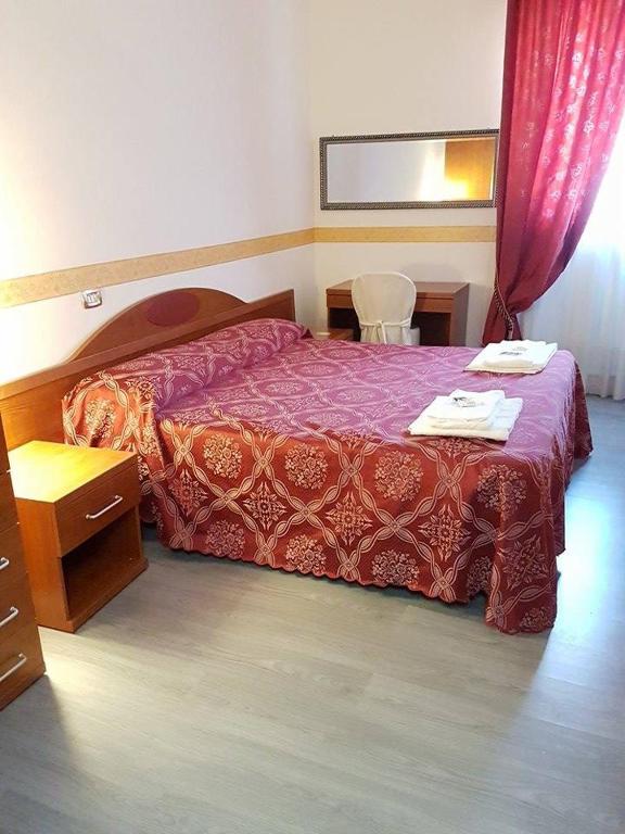 Postel nebo postele na pokoji v ubytování Villa Altieri