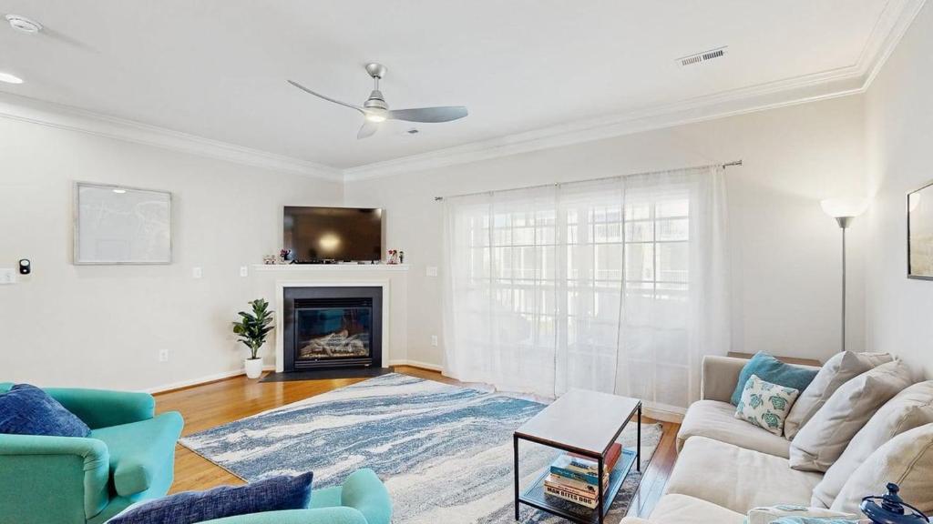 a living room with a couch and a fireplace at Rehoboth Crossing --- 19913 Ames Drive #106 in Rehoboth Beach