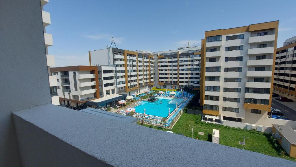 an aerial view of a swimming pool in a building at 85th Pool View 2 Rooms Apartament in Popeşti-Leordeni