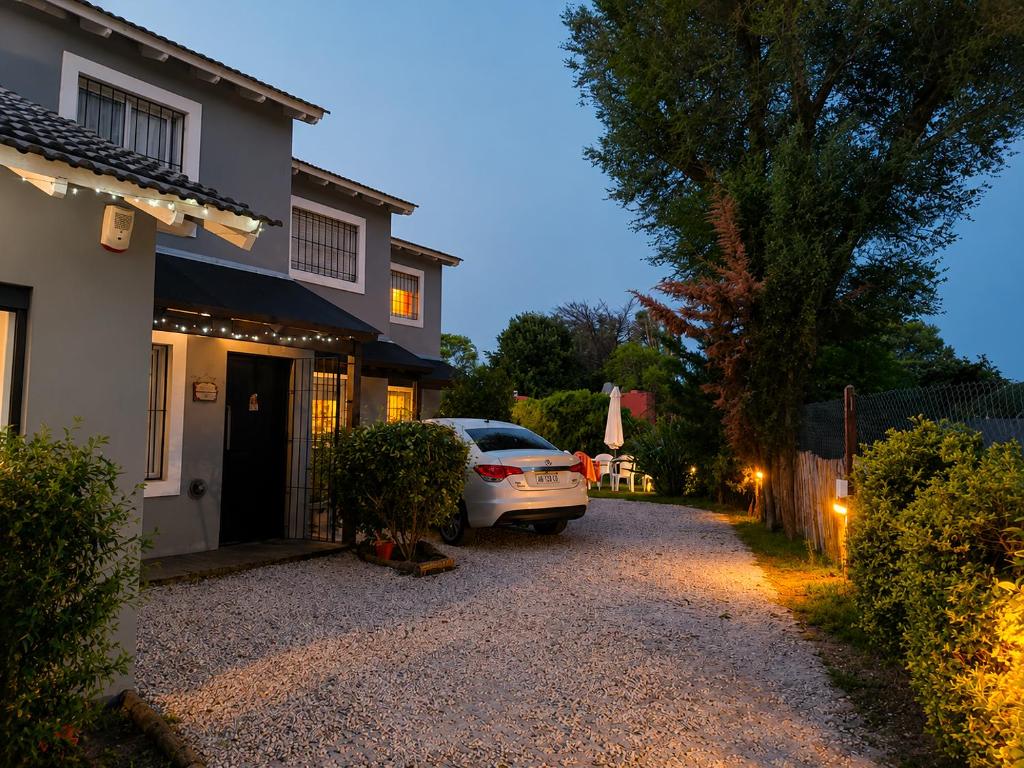 a car parked in front of a house at Tierra Mora Casas de alquiler in Villa Gesell
