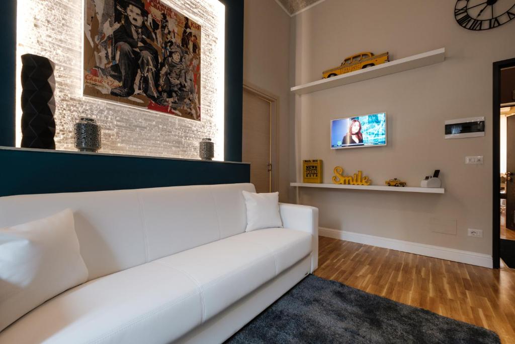 Televízia a/alebo spoločenská miestnosť v ubytovaní Apart Hotel Torino