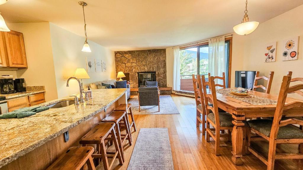 a kitchen and dining room with a table and chairs at 135 Marina Place in Dillon