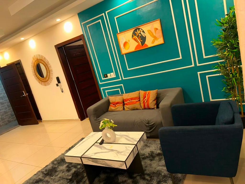 a living room with a couch and a table at Immobilier du siecle in Abidjan