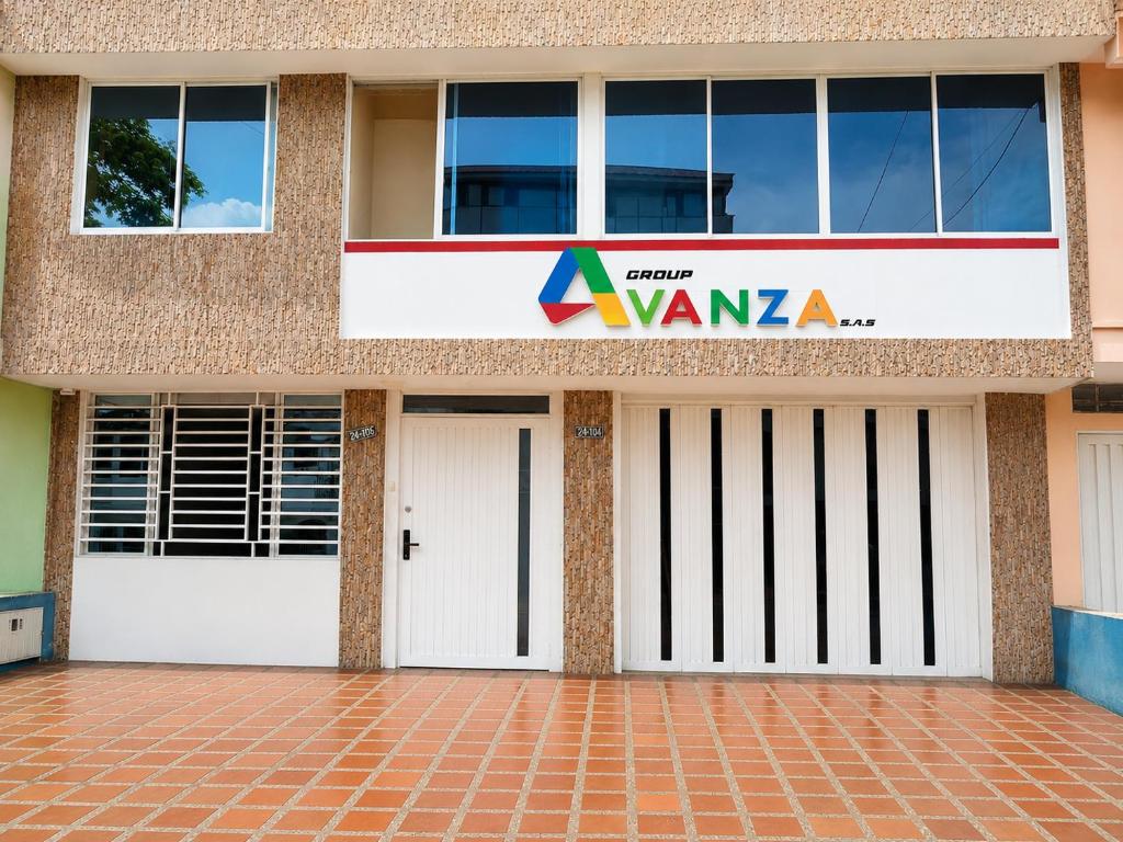 a building with two garage doors and a sign on it at Hostal Avanza in Cali