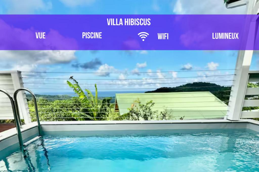a view from a swimming pool in a house at Villa Alizé Kreyol in Le François
