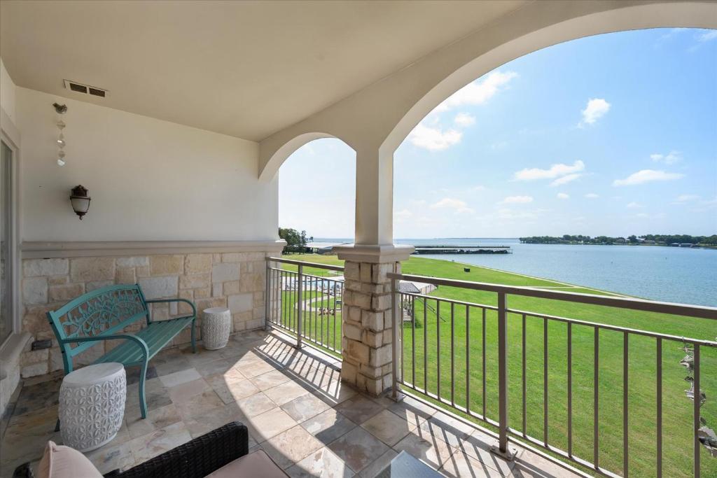 a balcony with a view of the water at Lakefront Paradise with Stunning Views! in Corsicana