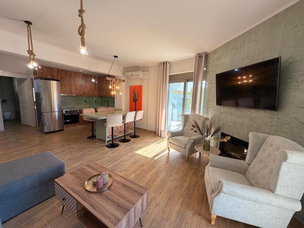 a living room with a couch and a table at Casa Marino in Chalkida