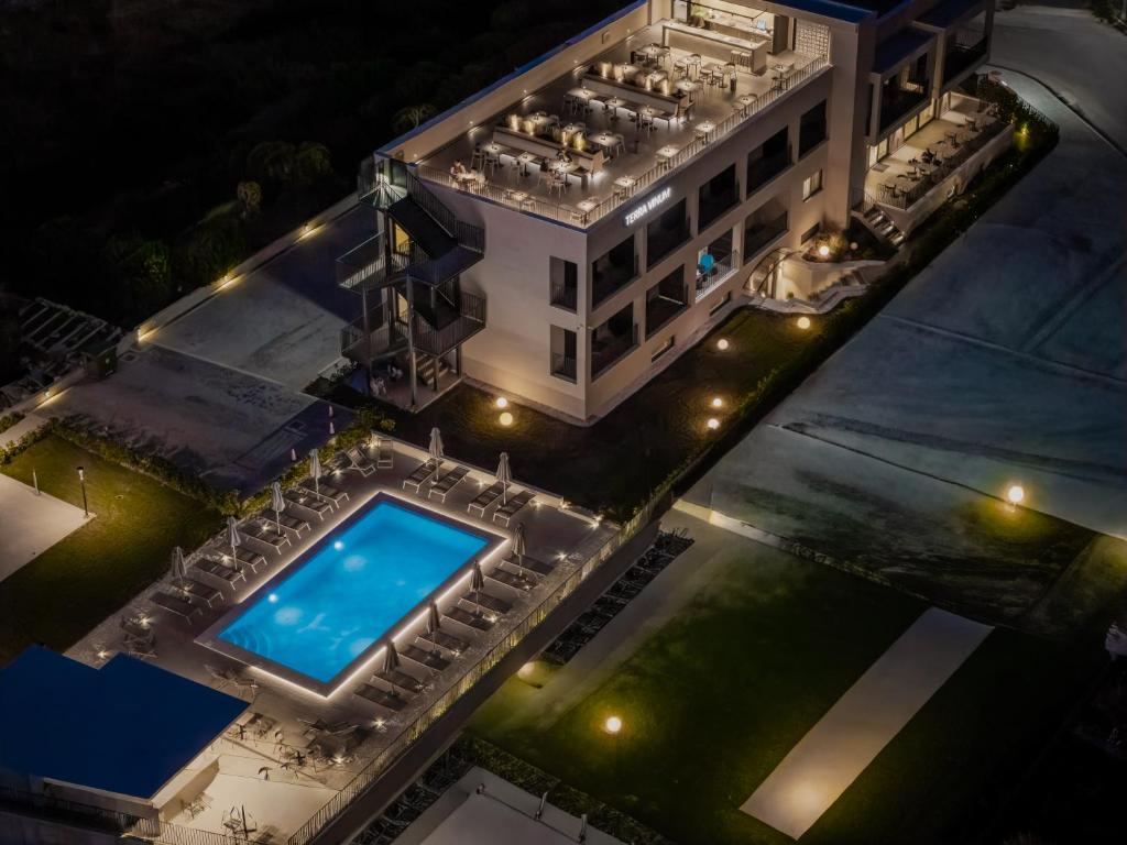 an overhead view of a building with a swimming pool at Terra Vinum in Neméa