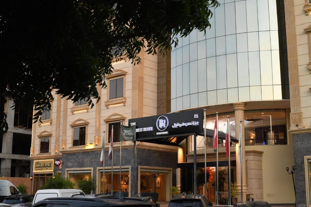 a building with cars parked in front of it at The Business Hotel By Seafront فندق ذا بيزنس in Jeddah