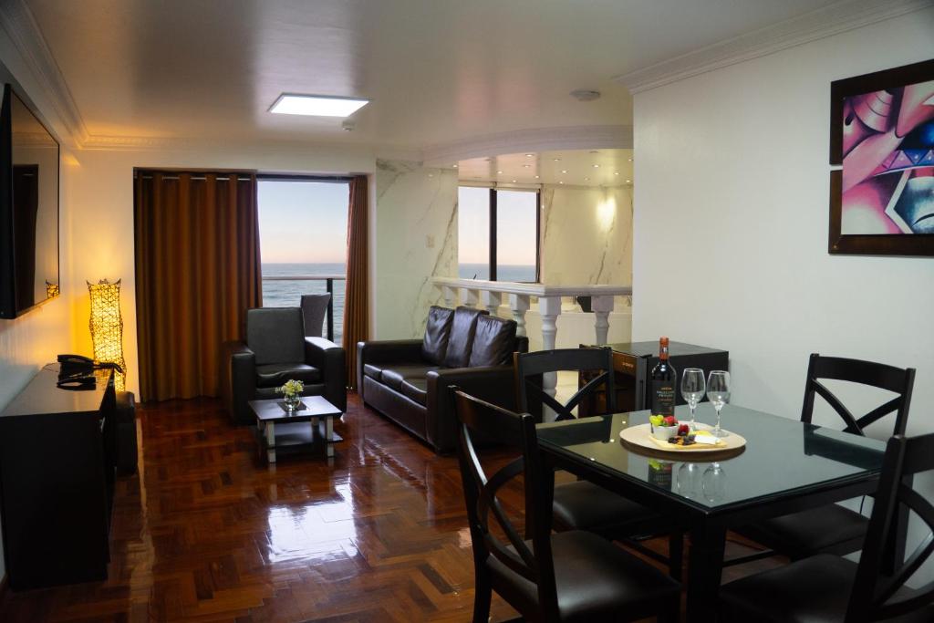 a living room with a table and a couch at Inkari Apart Hotel in Lima