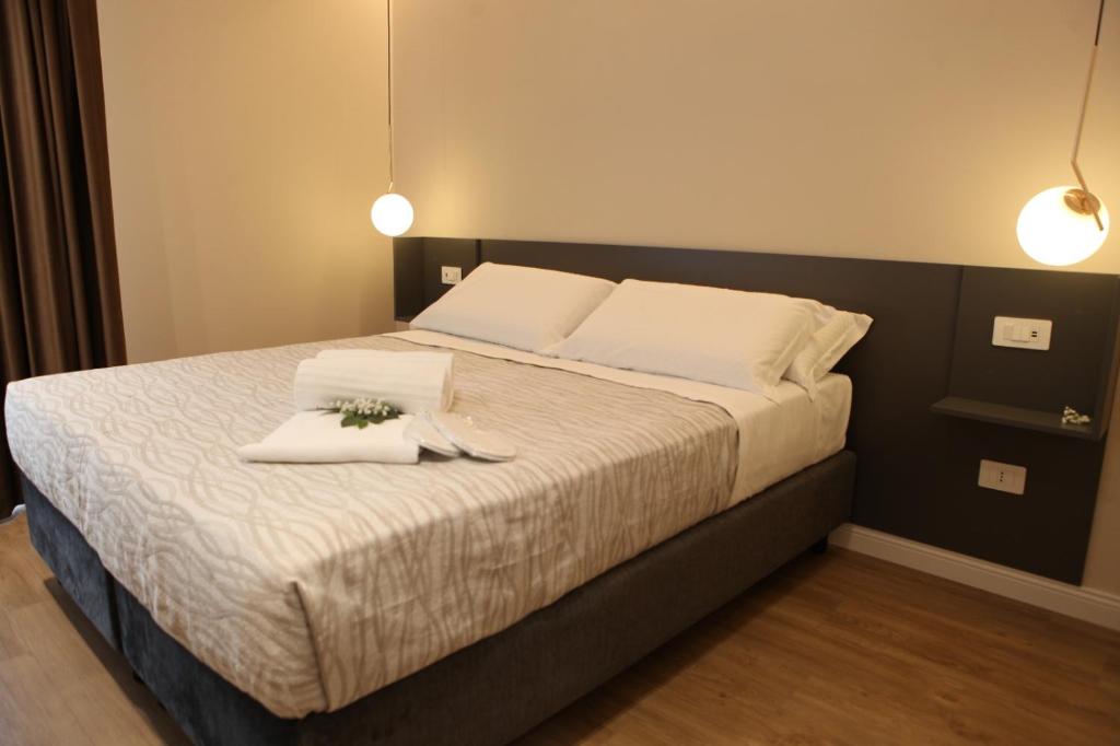 a bedroom with a large bed with flowers on it at Mariano Suites in Stigliano