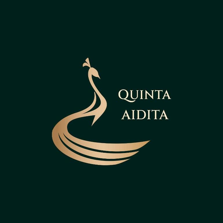 a logo for a company with a woman in the water at Hosteria Quinta Aidita in Guano